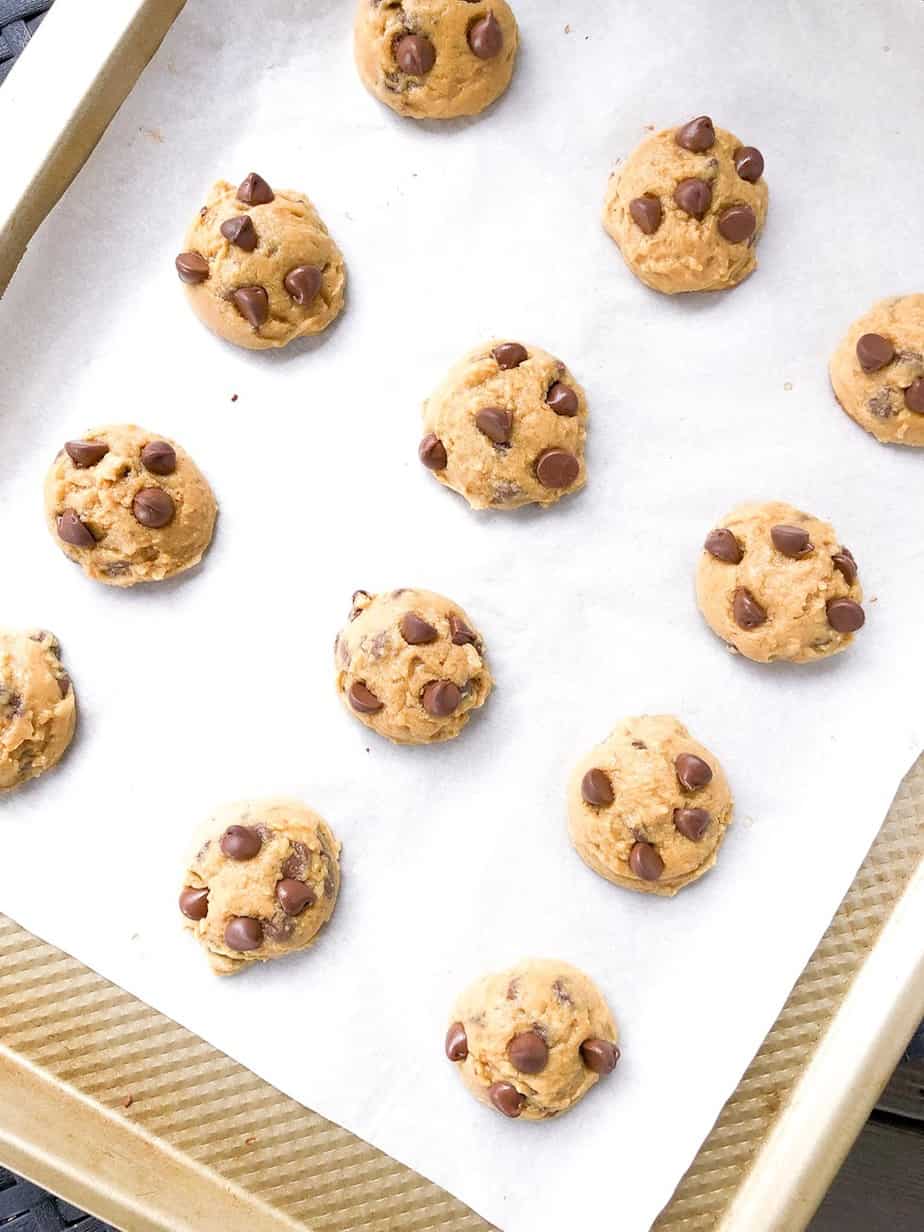 Vanilla chocolate chip pudding cookies on baking tray.