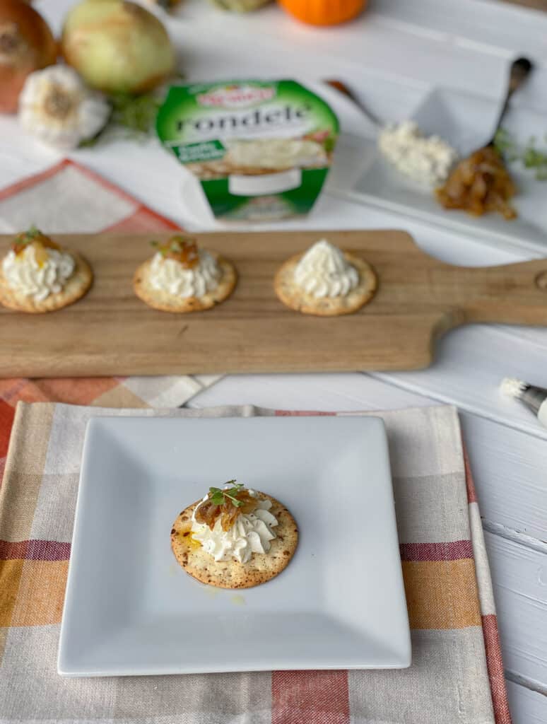 cheese and crackers on table.