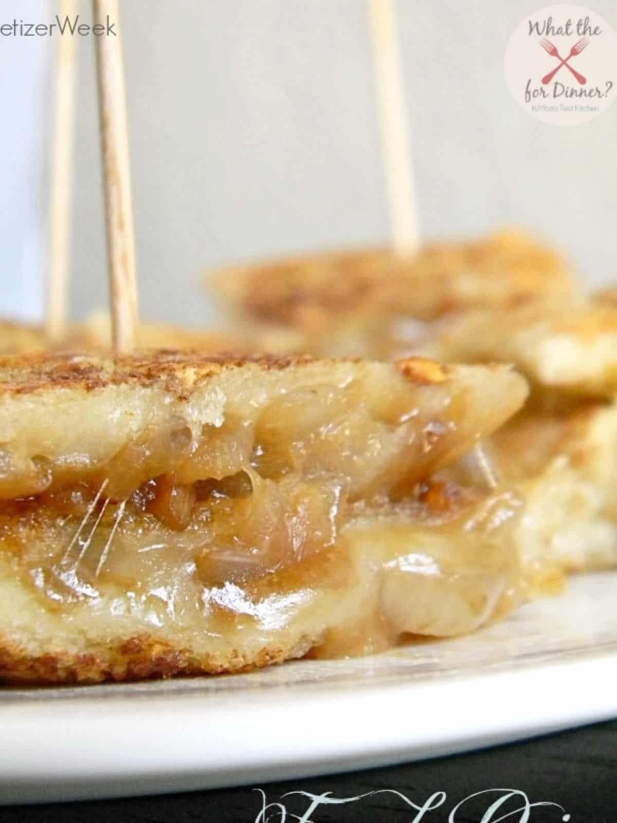 Mini grilled cheese sandwiches skewered.