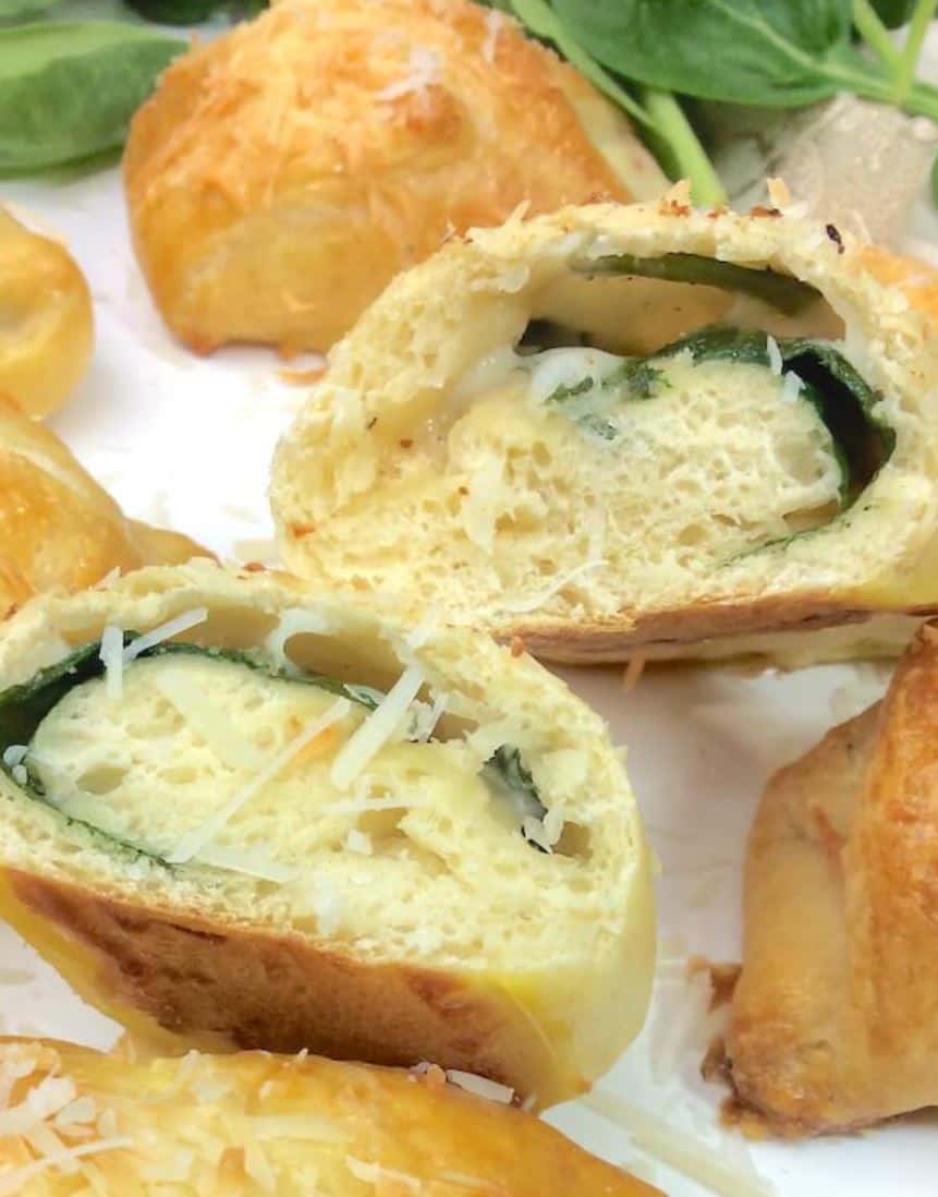 Spinach and parmesan croissants, cut in half.