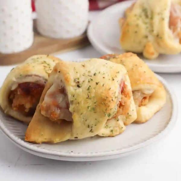 chicken parmesan sliders on a white plate.